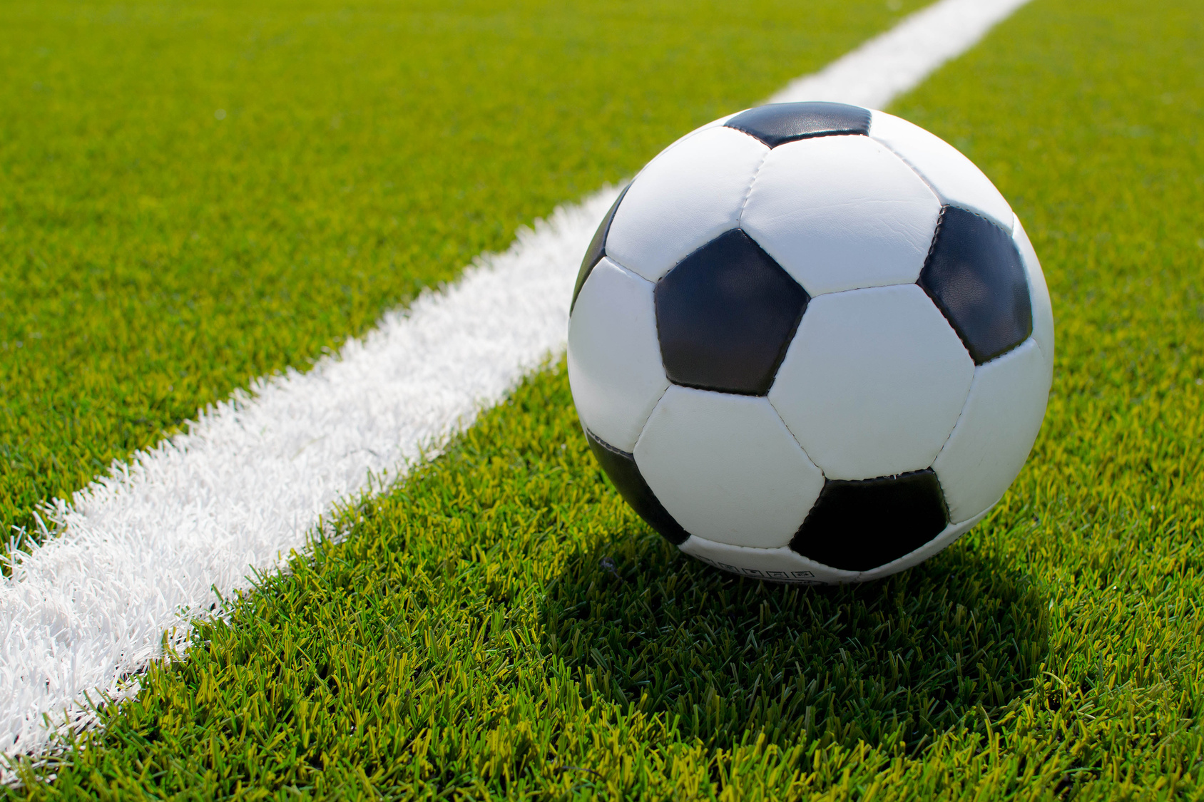 soccer ball on the green field